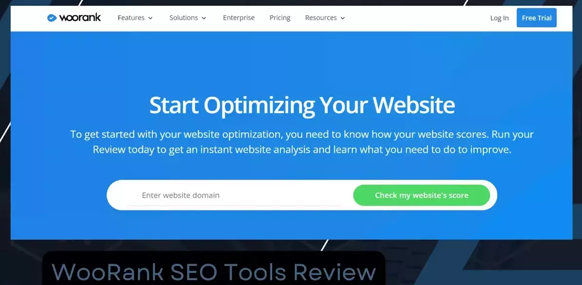 WooRank homepage with a blue background. The headline reads 'Start Optimizing Your Website.' Below, the text states, 'To get started with your website optimization, you need to know how your website scores. Run your Review today to get an instant website analysis and learn what you need to do to improve.' There is a search bar to enter a website domain and a green button labeled 'Check my website's score.' The top navigation includes links to Features, Solutions, Enterprise, Pricing, Resources, and options to Log In and a 'Free Trial' button.
