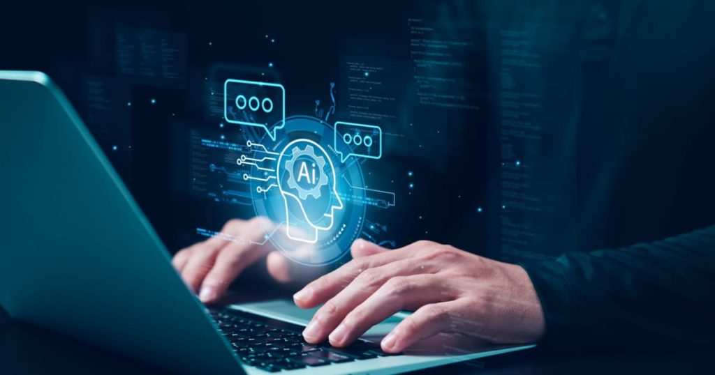A person typing on a laptop with a digital overlay of an AI icon and various technology-related icons and text. The overlay includes a graphic of a human head with gears and the letters 'AI' inside, along with speech bubbles and data processing visuals, representing the integration of artificial intelligence in content creation and technology.