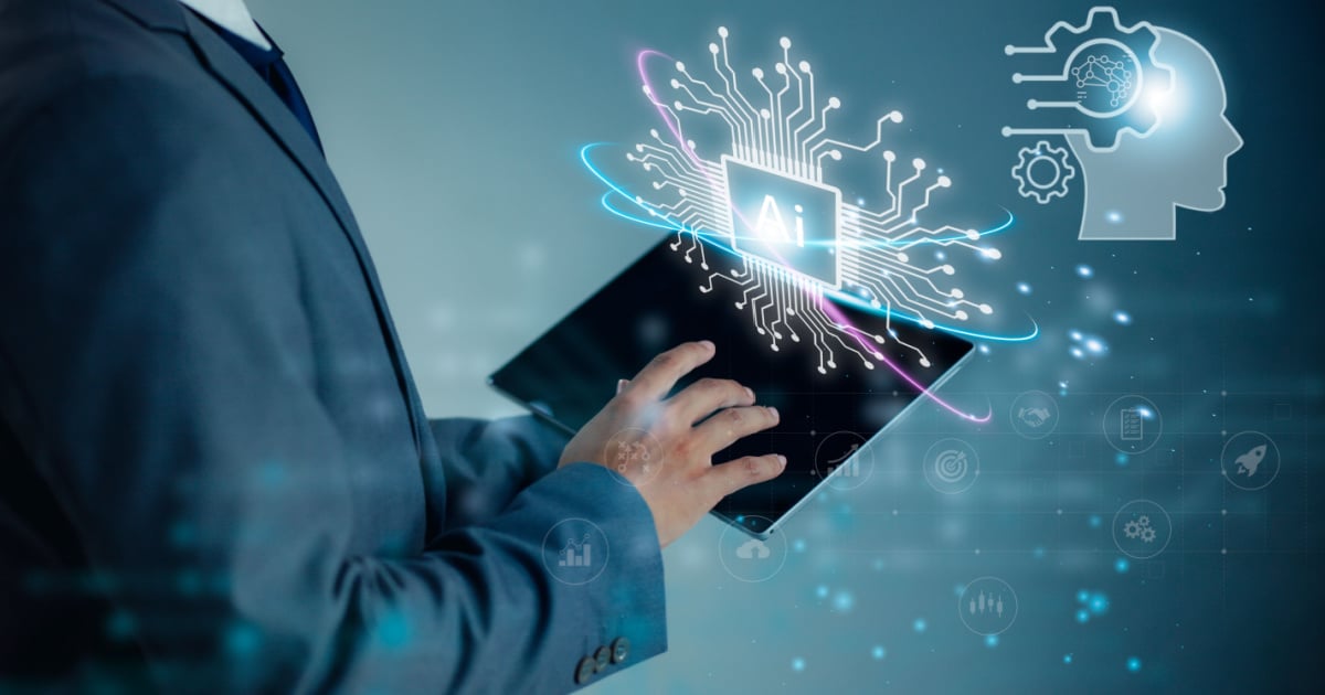Person using a tablet with a digital representation of AI technology and brain icons.